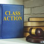 Book about class action lawsuit on the shelf.