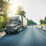 Semi-truck 18 wheeler on the highway delivering freight